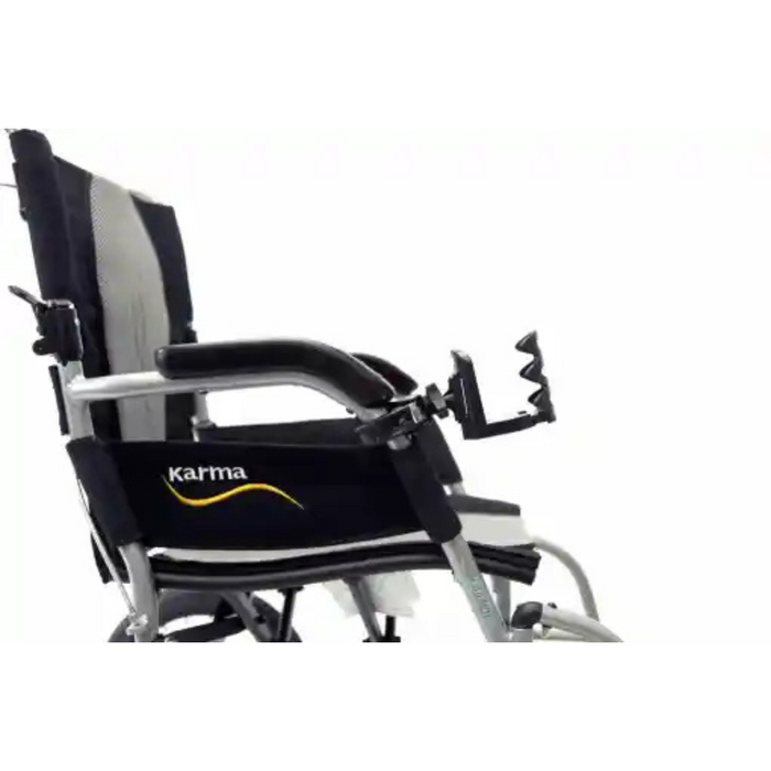 The image shows a close-up side view of a lightweight mobility device with a black fabric seat and backrest, featuring the Karma logo. It includes metal curved armrests, footrests, and an adjustable Karman Cup Holder for Mobility Aids, set against a white background.