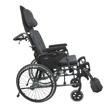 Side view of the Karman Aluminum Ultra Lightweight MVP-502 Reclining Wheelchair in black, featuring a high backrest, headrest, armrests, large rear wheels, small front wheels, and extended forward footrests for pressure relief comfort.