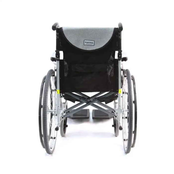 A black and silver Karman S-Ergo 105 Wheelchair with Fixed Footrest & Ergonomic Seat viewed from the back, showcasing two large rear wheels and a mesh pocket for ergonomic design and lightweight maneuverability.