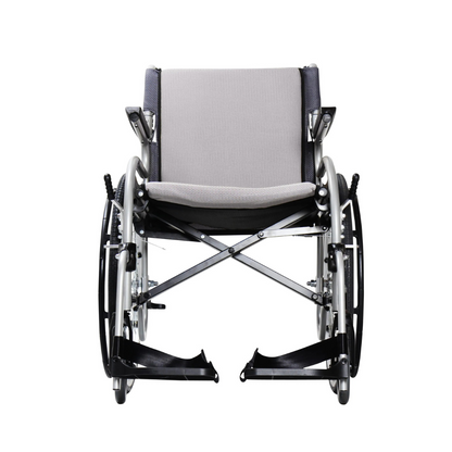 A front view of the Karman Healthcare STAR 2 Lightweight Folding Wheelchair in light gray with black armrests and footrests, shown empty and isolated on a white background.