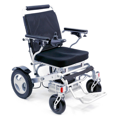 The Karman Tranzit Foldable Lightweight Power Wheelchair, FAA Approved, features a black seat and backrest, armrests with a right-side joystick, footrests, large rear wheels paired with smaller front ones, providing compact mobility convenience.