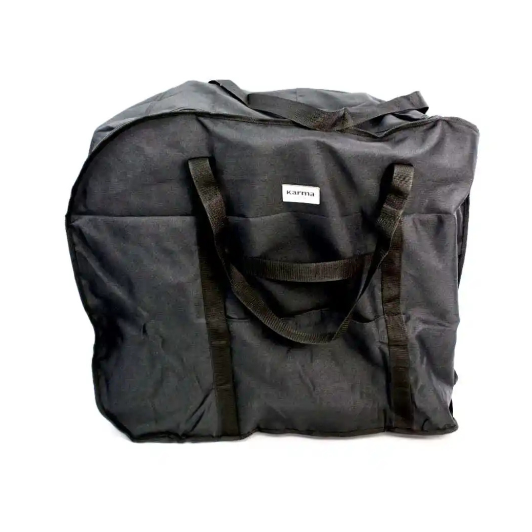 The Karman Travel Bag for Ergo Lite & Ergo Flight Wheelchairs is a large black water-resistant bag with two handles and a small white karma label on the front, shown against a plain white background.