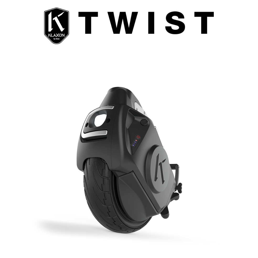 A black Klaxon® Twist Mobility Power-Assist Hub | Wheelchair Power Assist is angled on a white background, with “TWIST” and a KLAXON shield logo above, emphasizing its wheelchair power assist feature.