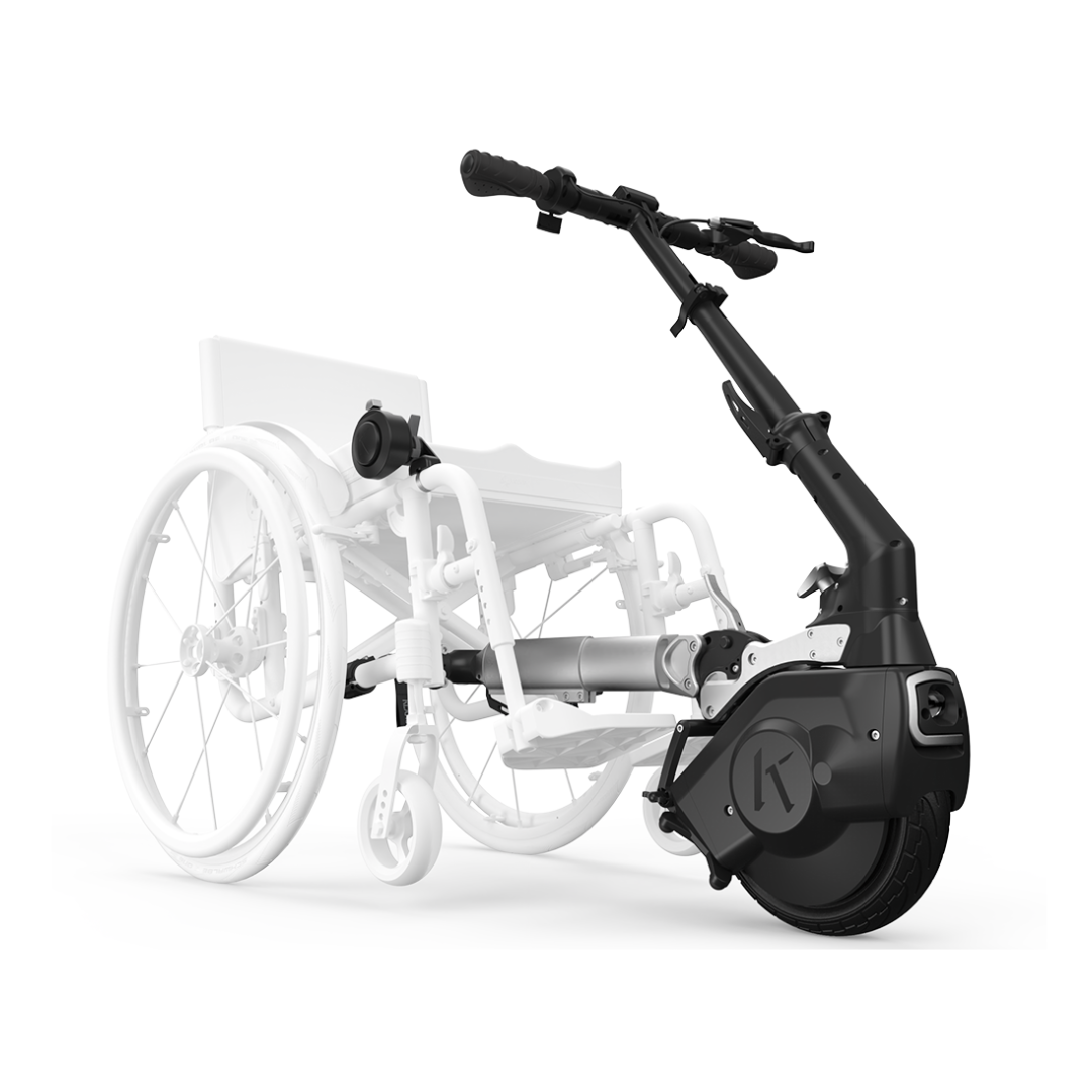 A black Klaxon® Twist Mobility Power-Assist Hub | Wheelchair Power Assist is attached to the front of a semi-transparent manual wheelchair, enhancing mobility and making wheelchair movement easier.
