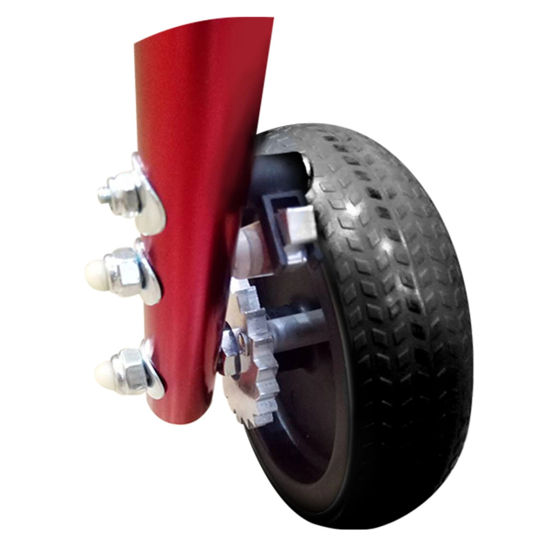 Close-up of a small black rubber wheel attached with bolts to a red metal frame of the Circle Specialty Klip Pediatric Posterior Walker, isolated on a white background.