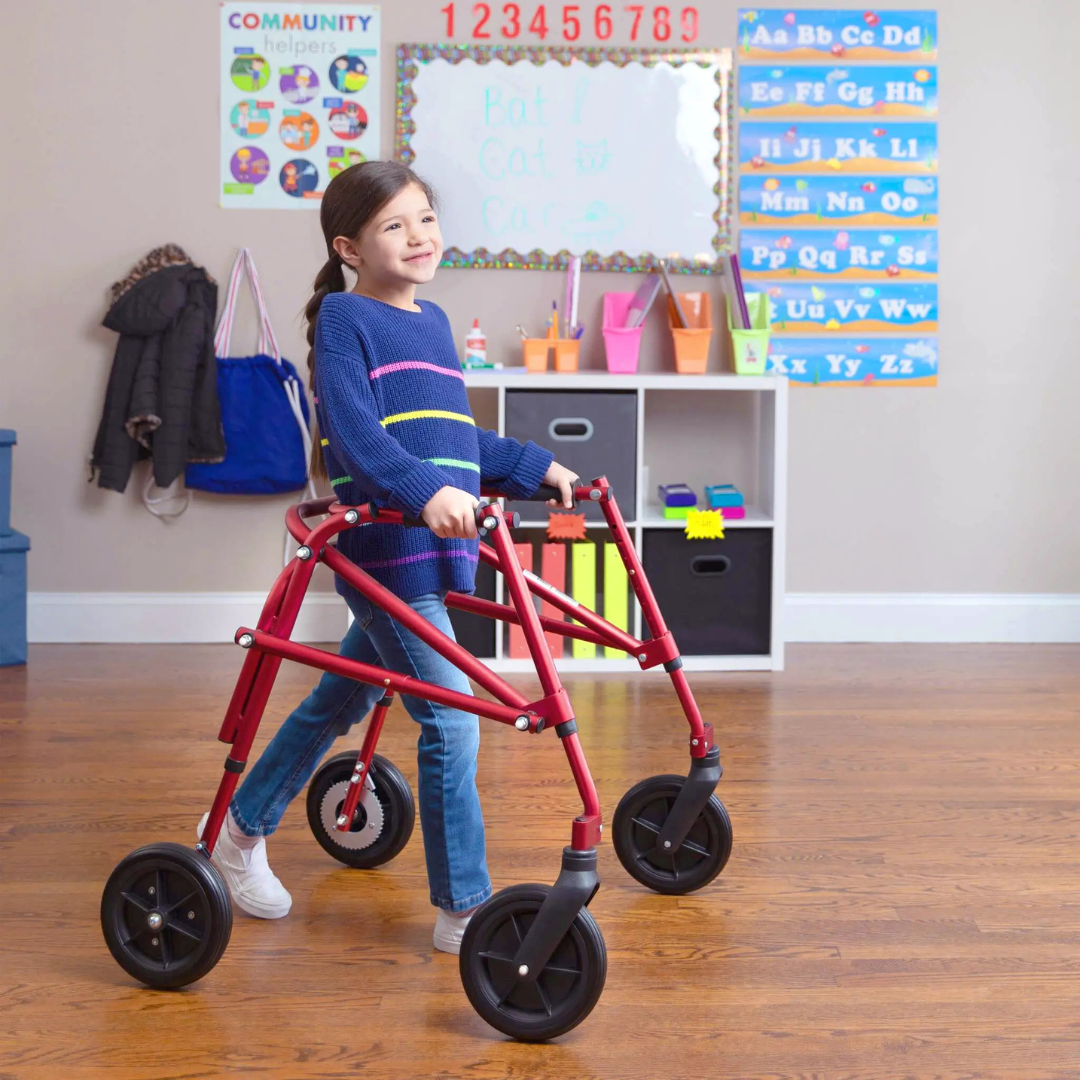 A girl walking with support from the Circle Specialty Klip Pediatric Posterior Walker.