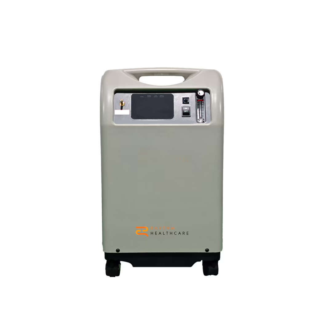 The Rhythm 10LPM Stationary Oxygen Concentrator features a digital display, control knobs, and a top handle, delivering high-flow oxygen while resting on four black wheels against a white background.
