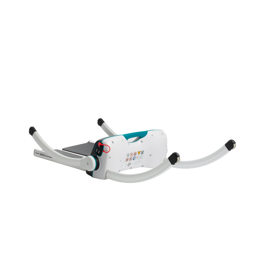 The LiftUp Raizer II, a folding, portable baby bath support with a white base, teal accents, grey non-slip feet, and curved legs—shown partially extended on a white background. Comes with user manual featuring care instructions and specs.