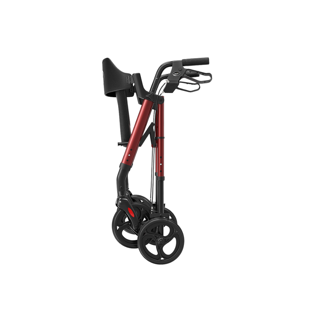 A Lightweight Folding 4-Wheel Rollator | VOCIC Z21 in red and black is displayed upright in a folded position, featuring ergonomic hand grips and a convenient seat above four wheels, all set against a plain white background.