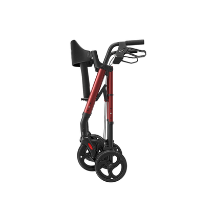 A Lightweight Folding 4-Wheel Rollator | VOCIC Z21 in red and black is displayed upright in a folded position, featuring ergonomic hand grips and a convenient seat above four wheels, all set against a plain white background.