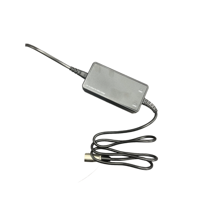 A black, rectangular Lithium Battery Charger 2AH by Monarch Mobility, featuring a cord with a cylindrical connector, is displayed on a white background.