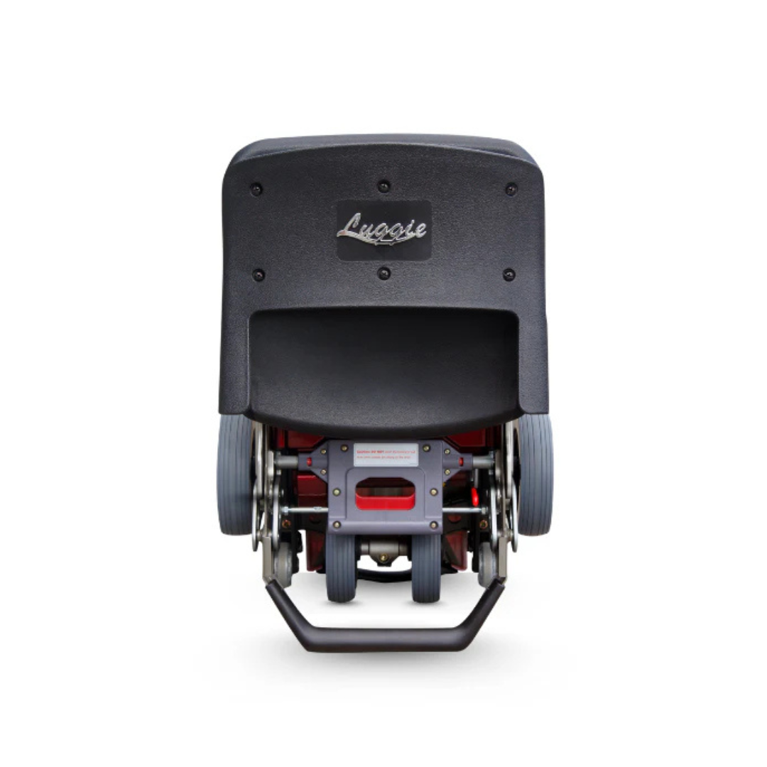 A stair-climbing wheelchair attachment shown from the back, featuring a black seat labeled FreeRider Luggie Standard Travel Scooter, sturdy metal handle at the base, and design inspired by portable mobility scooter technology.