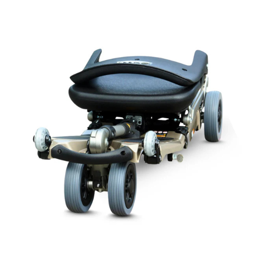 The FreeRider Luggie Standard Travel Scooter is a lightweight, foldable mobility scooter with large front wheels and a black cushioned seat—ideal for easy transport and convenient accessibility on the go.