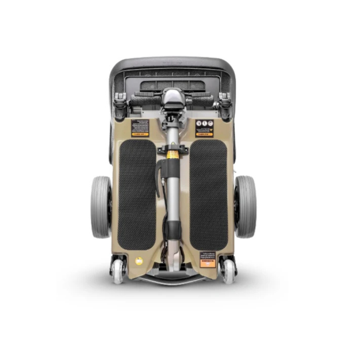 The FreeRider Luggie Standard Travel Scooter is a foldable mobility aid with a compact design, large rear wheels, small front wheels, and neatly placed footrests—ideal for portability and travel.