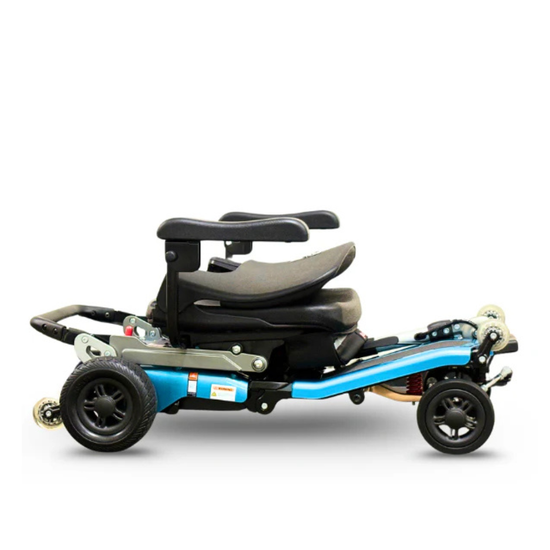 The FreeRider Luggie Super Plus 4 Travel Scooter is a compact, lightweight mobility device with a blue frame, black seat, armrests, and four wheels—folding for easy transport and storage like advanced travel scooters.