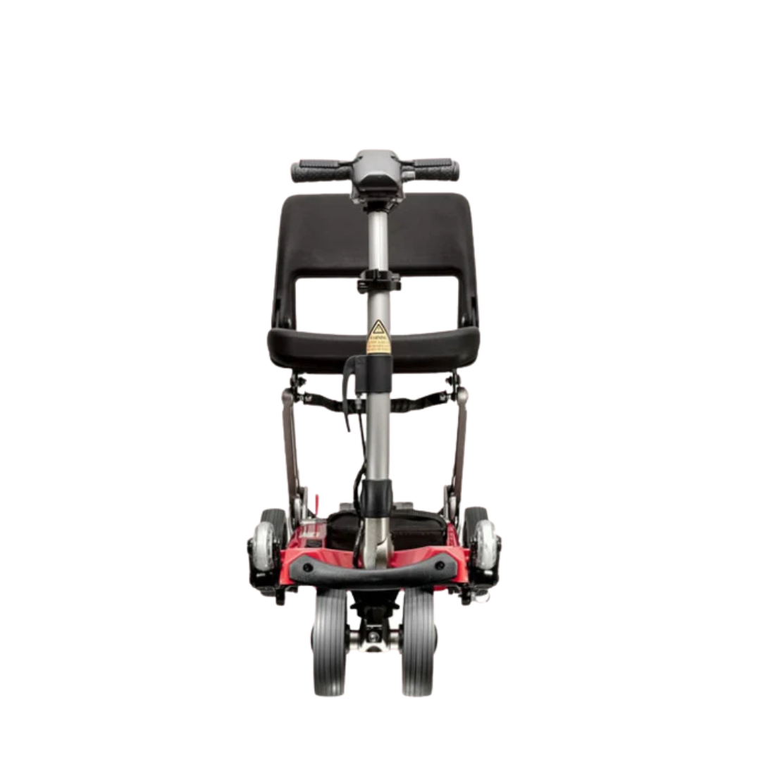 Front view of the FreeRider Luggie Classic II Travel Scooter, a compact, airline-approved model with a black seat and red base, shown against a white background.