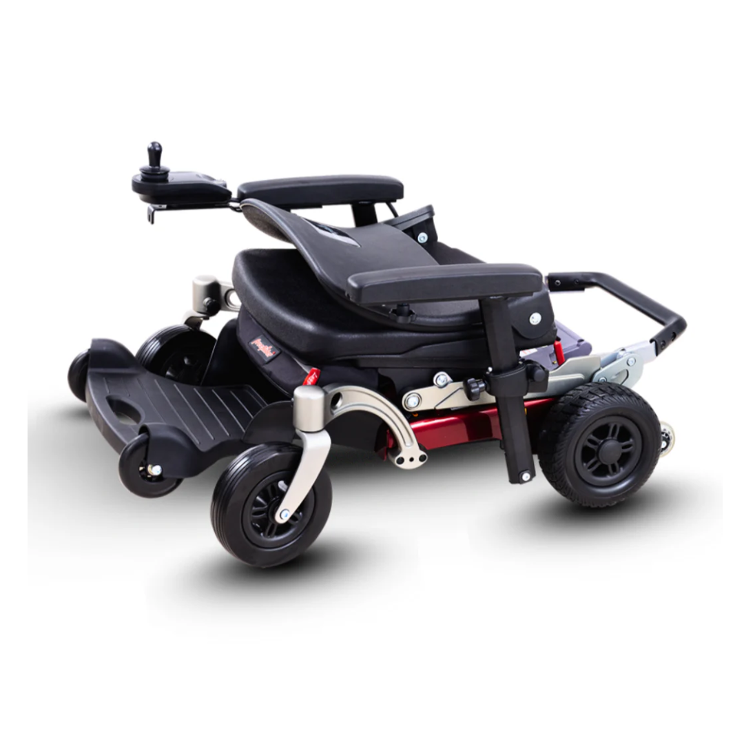 The FreeRider Luggie Travel Lightweight Powerchair is a compact, modern electric wheelchair with a black seat, armrests, joystick control, four wheels, red accents, and a folding design for easy storage.