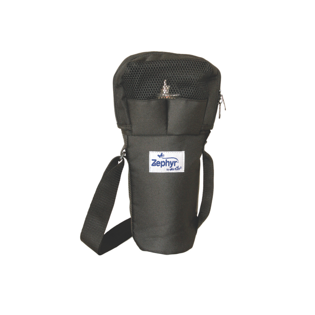 The Zephyr Oxygen Cylinder Shoulder Bag is a black carry bag with a mesh top, shoulder strap, and front label. The portable oxygen bag stands upright against a white background.