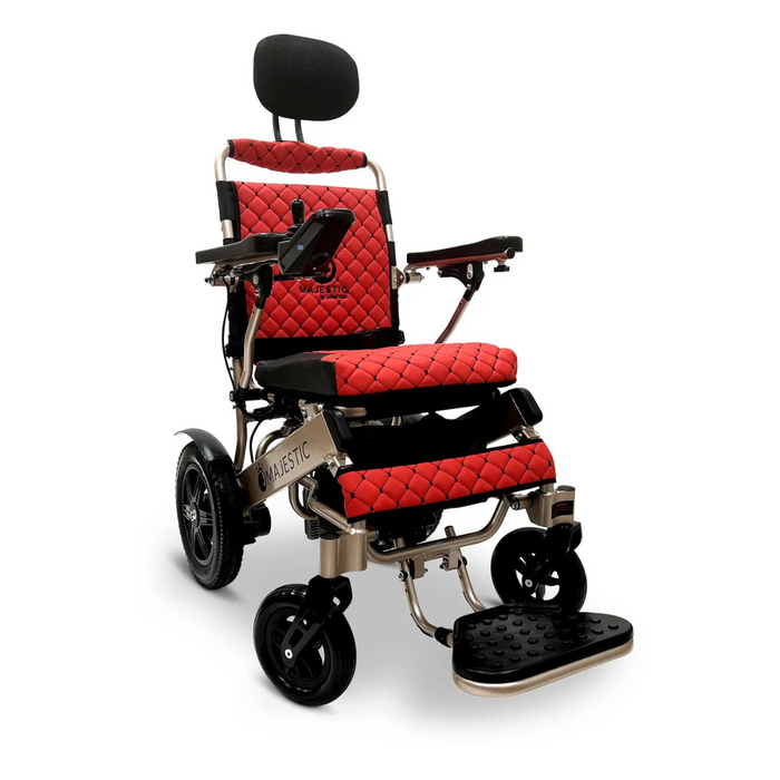 The ComfyGo MAJESTIC IQ-9000 Auto Folding Electric Wheelchair offers a red and black quilted seat design, adjustable armrests, headrest, footrest, brushless silent motors, sleek black wheels, and a sturdy metallic frame controlled by a digital joystick controller.