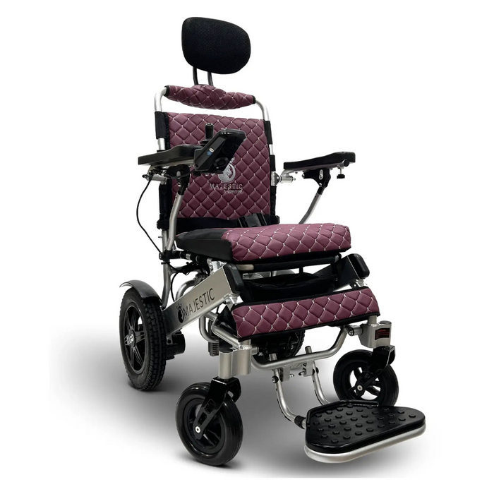 Meet the ComfyGo MAJESTIC IQ-9000 Auto Folding Electric Wheelchair, featuring a quilted mauve cushion, padded armrests, headrest, footrests, and black wheels. Powered by silent brushless motors and a digital joystick controller for smooth rides. Enjoy next-level comfort and control.