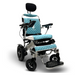 The ComfyGo MAJESTIC IQ-9000 is a blue and silver electric wheelchair featuring a diamond-patterned cushioned seat, headrest, armrests, footplate, and auto-reclining function. It has brushless silent motors for smooth operation and a digital joystick controller on one armrest.