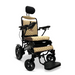 The ComfyGo MAJESTIC IQ-9000 Auto Folding Electric Wheelchair features a sleek black frame with beige quilted upholstery, headrest, armrests, and footrest. Large wheels and a right-armrest digital joystick controller pair with brushless silent motors for smooth, quiet operation.