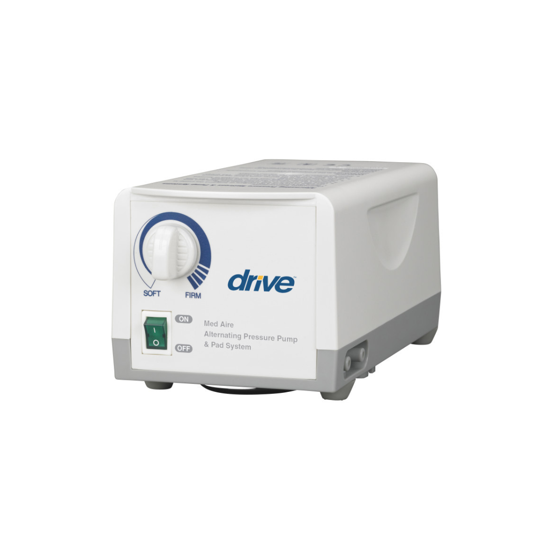 The Drive Med-Aire Alternating Pressure Pump and Pad System is white and gray, featuring a firmness adjustment dial, on/off switch, and indicator lights for use with compatible pressure pad systems.