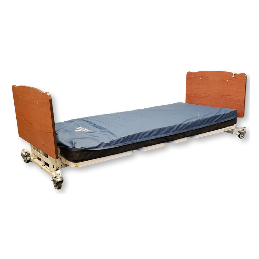 The Med-Mizer AllCare Full Electric Hi/Low Bed - Expandable Width is shown with a blue mattress, wooden headboard and footboard, and wheels on each leg, against a white background.