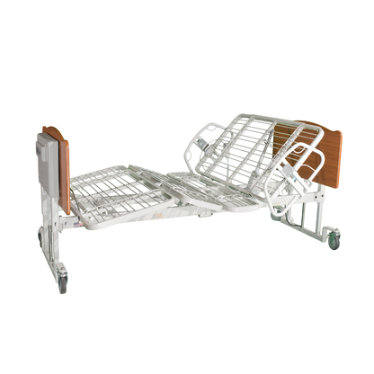 The Med-Mizer EX8000 ComfortWide Bariatric Width Adjusting Electric Bed features adjustable head and knee sections, metal rails, wooden head and footboards, and wheels for mobility. Shown partially elevated for comfort.