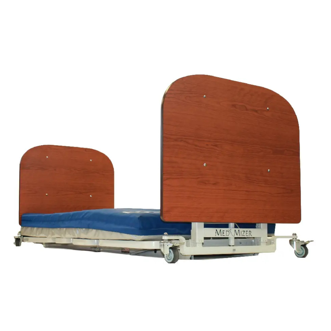 The Med-Mizer AllCare Full Electric Hi/Low Bed - Expandable Width features a wooden headboard and footboard, blue mattress, mobility wheels, and is labeled Med-Mizer on the base.