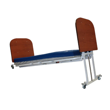 A Med-Mizer AllCare Full Electric Hi/Low Bed - Expandable Width is shown at an angle on caster wheels, featuring a blue mattress, metal frame, and wooden headboard and footboard against a white background.
