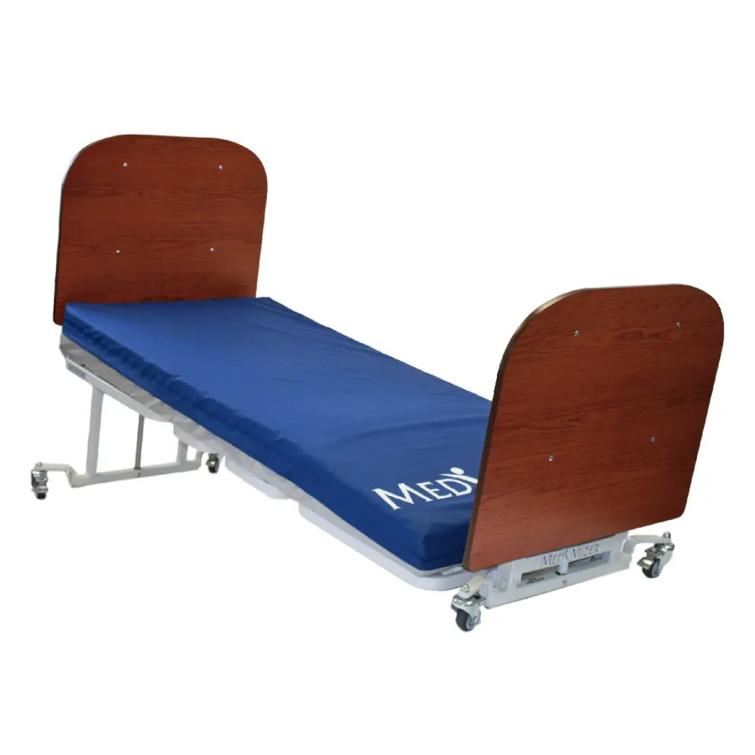 A Med-Mizer AllCare Full Electric Hi/Low Bed – Expandable Width, with wooden head and footboards, blue MEDI mattress, and four caster wheels for mobility.