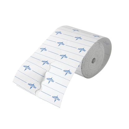 A roll of Medline MedFix Dressing Retention Tape with blue lines, "NEED LINE" printed repeatedly, and perforations for easy tearing.