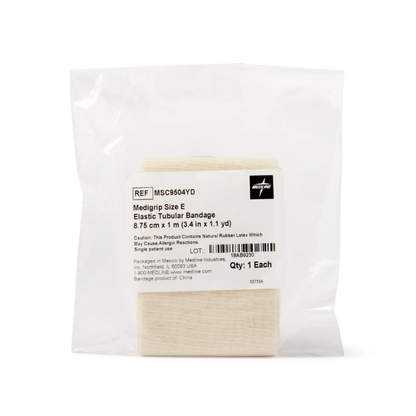 A sealed plastic pack contains a Medline Medigrip Elastic Latex Tubular Support Bandage. The white label lists product details, size (8.75 cm x 1 m), and quantity (1 each). The beige bandage is partially visible inside.