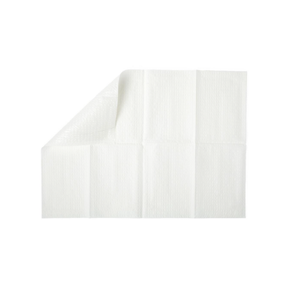 A white disposable underpad with a quilted pattern, partially folded at one corner, is shown on a plain white background next to Medline 2-Ply Tissue/Poly Professional Towels.
