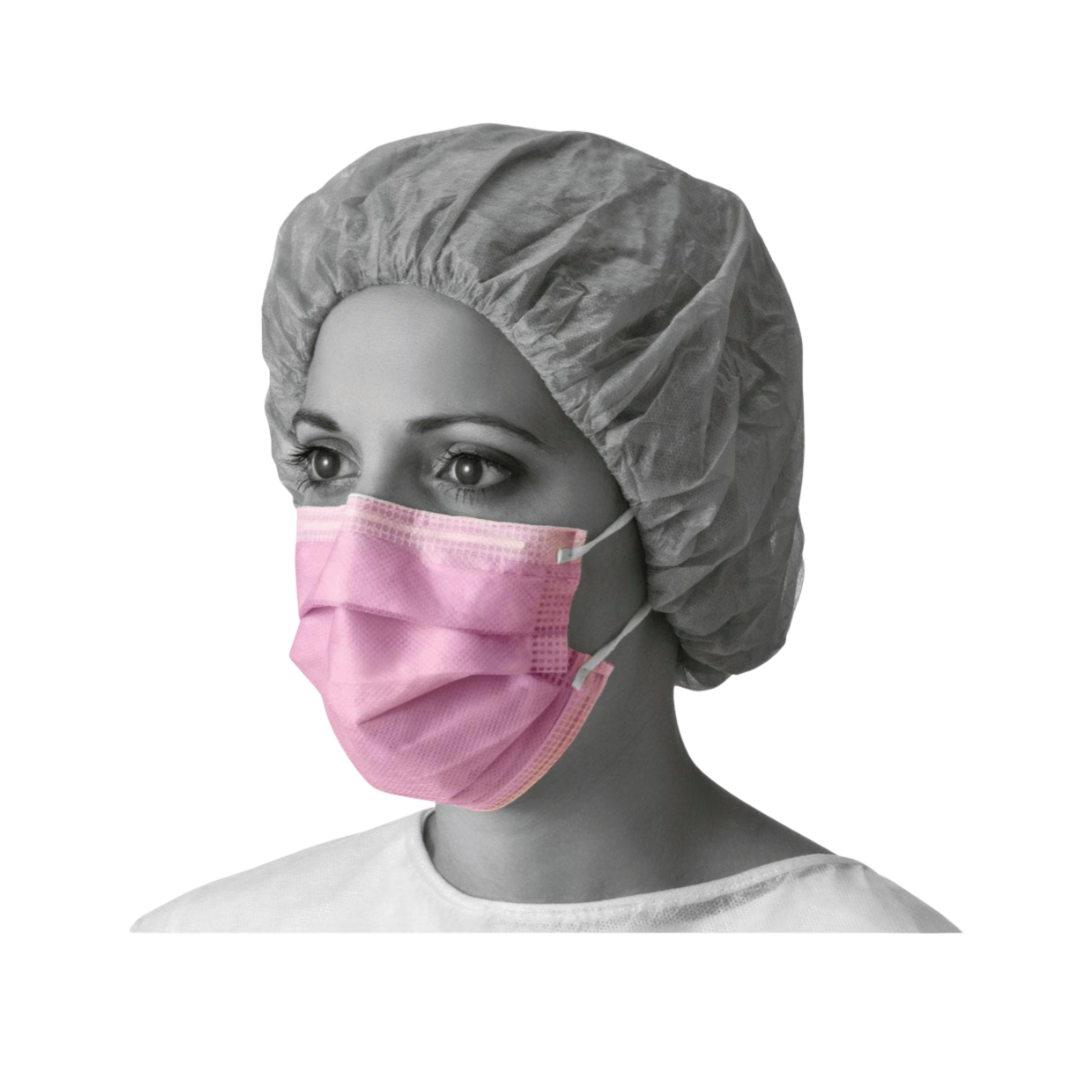 A person wearing a gray disposable hair cap and a pink Medline ASTM Level 3 Procedure Face Mask with ear loops, shown from the shoulders up and looking slightly to the left against a plain white background.