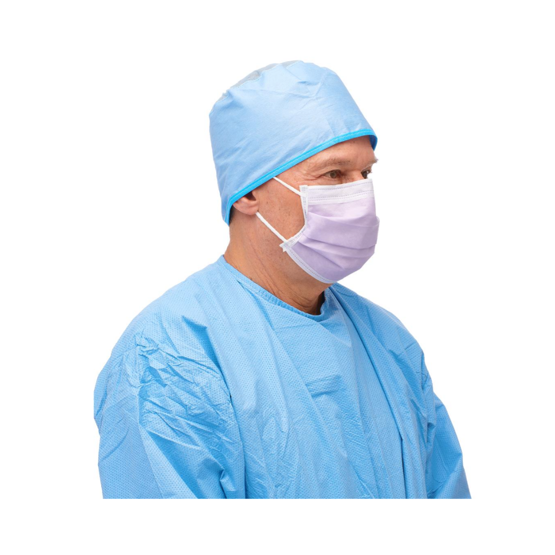 A person in a blue surgical gown and cap wears a Medline ASTM Level 3 Procedure Face Mask with ear loops (lavender), shown from the side against a white background.