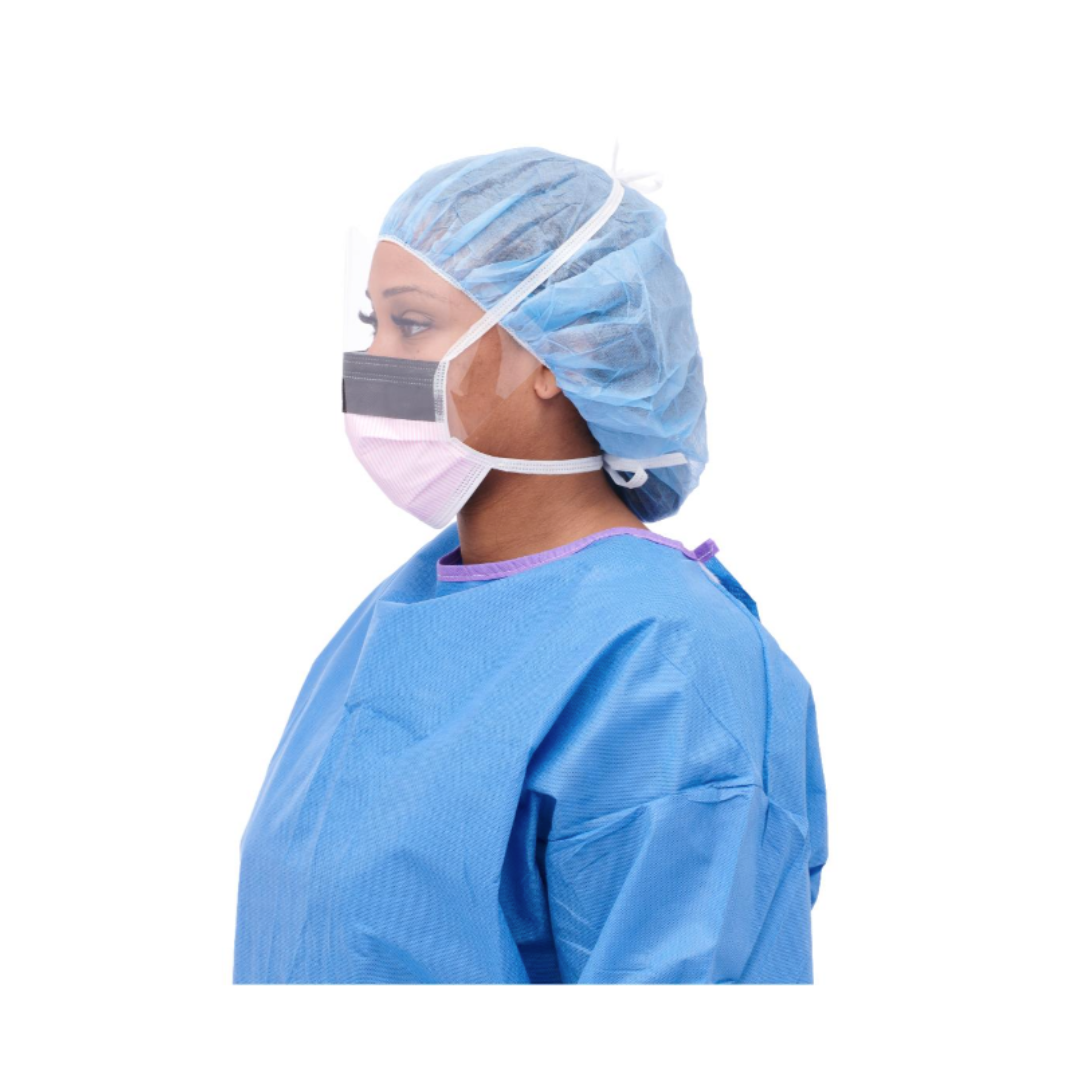 A person in profile against a white background wears a blue surgical gown, blue hair cover, and a Medline ASTM Level 3 Surgical Face Mask with Eye Shield.