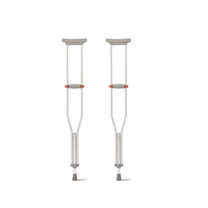 Medline Aluminum Crutches with Red Dot Hand Grip feature gray underarm pads and rubber tips, plus push-button height adjustment. They stand upright on a white background.