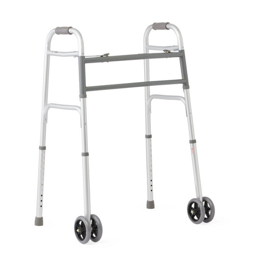 The Medline Bariatric Folding Walker with XL Wheels is a lightweight, silver walker featuring two front wheels, adjustable legs, an extra-wide frame, a grey horizontal support bar, padded hand grips, designed for high weight capacity and optimal mobility.
