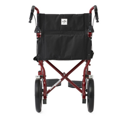 The Medline Lightweight Aluminum Transport Chair features a rear view of its red foldable frame, 12 large rear wheels, footrests, a black seat with handles, and easy-to-use hand brakes for enhanced safety and convenience.