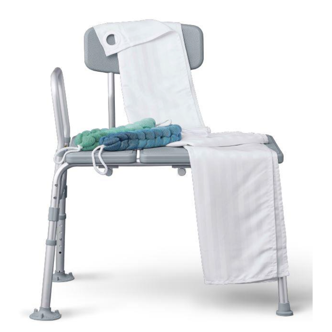The Medline Bathe Safe and Easy Kit for Caregivers with Shower Transfer Bench includes a gray chair with padded backrest, white towel over the seat and back, and a blue-green textured bath sponge—ideal for bath safety.