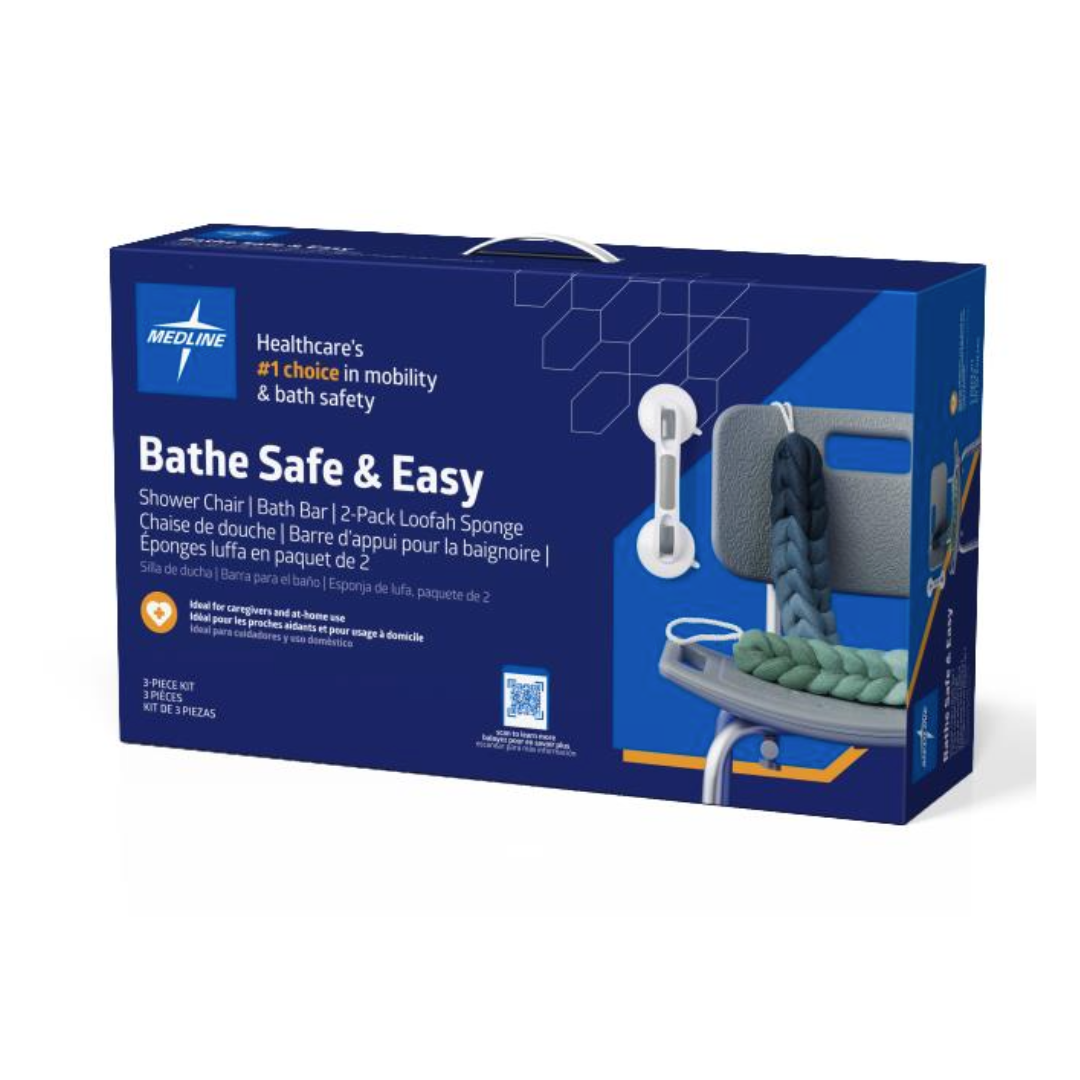 A blue Medline box labeled "Bathe Safe & Easy Kits for Caregivers with Shower Chair" displays images of a shower chair, bath bar, handheld showerhead, and loofah sponges, plus product info in English and French for bath safety.