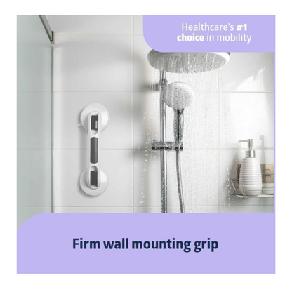 A Medline Bathe Safe & Easy Kit for Caregivers with Shower Chair is installed in a tiled shower with a grab bar, handheld showerhead, and bath essentials. Water sprays from the showerhead. Text: Healthcares #1 choice for bath safety and mobility.