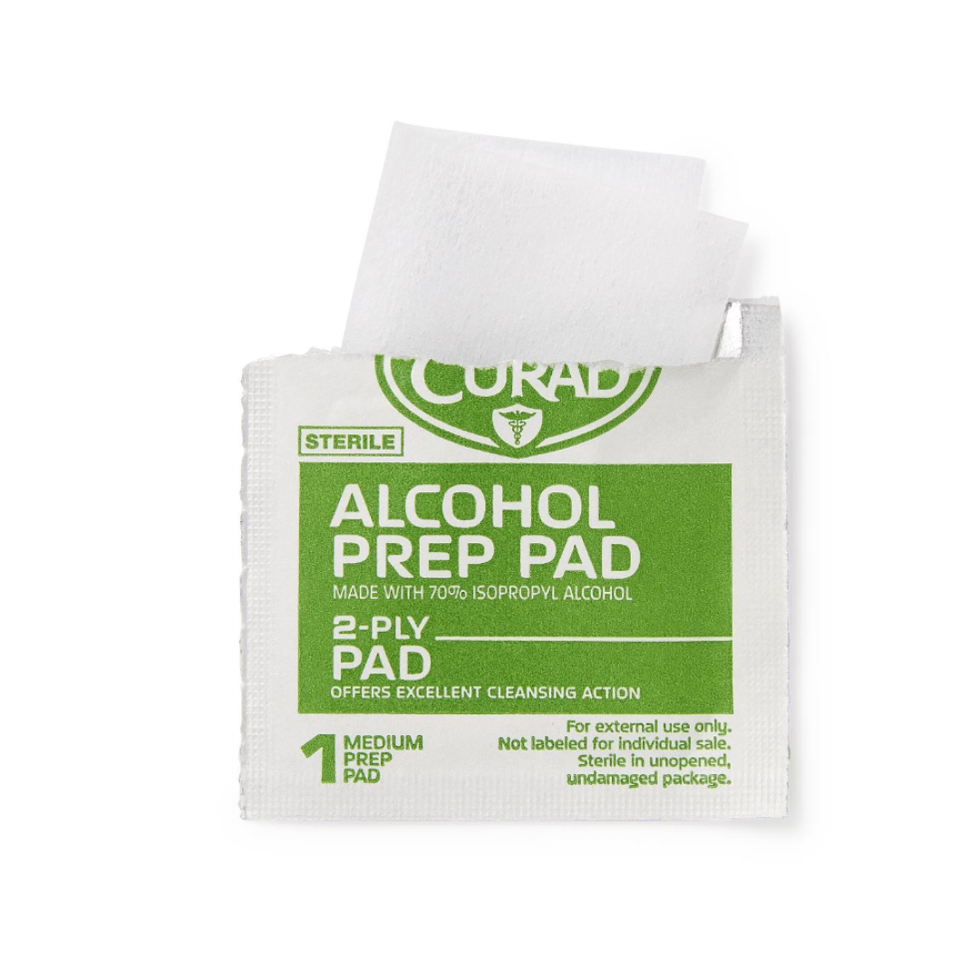 A partially opened Medline CURAD Medium 2-Ply Sterile Alcohol Prep Pads packet reveals a white pad. The green and white packaging notes 70% isopropyl alcohol and "Medium CURAD Alcohol Prep Pads.