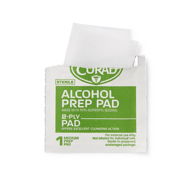 A partially opened Medline CURAD Medium 2-Ply Sterile Alcohol Prep Pads packet reveals a white pad. The green and white packaging notes 70% isopropyl alcohol and "Medium CURAD Alcohol Prep Pads.