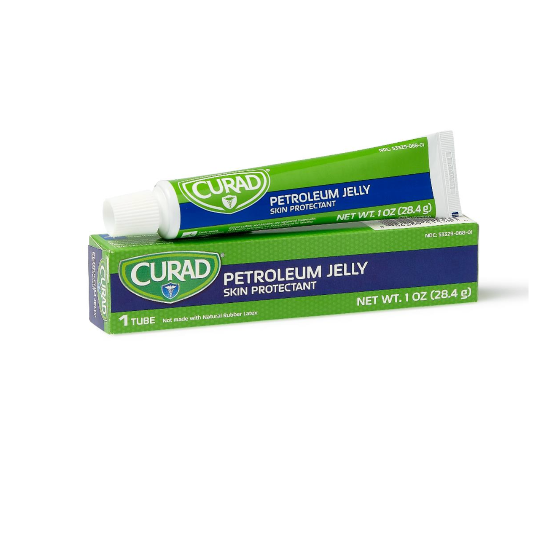 A green and blue tube of Medline CURAD Petroleum Jelly, labeled 1 oz (28.4 g), rests on its matching box. The multi-use skin protectant is partially uncapped and tilted forward.