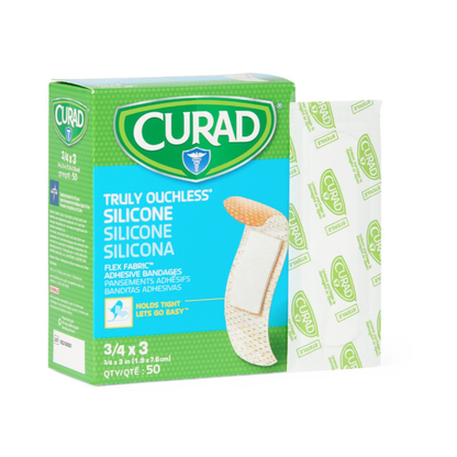 A green box of Medline CURAD Silicone Fabric Adhesive Bandages - 3/4" x 3" is shown with one bandage and its wrapper beside it. The box contains 50 fabric bandages—see the spec table for more details.
