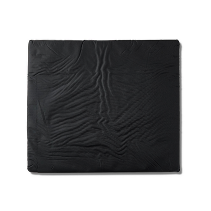 The Medline Comfort Foam Cushion, 3 thick, is a large black rectangular wheelchair cushion with a slightly wrinkled, textured surface shown against a white background.