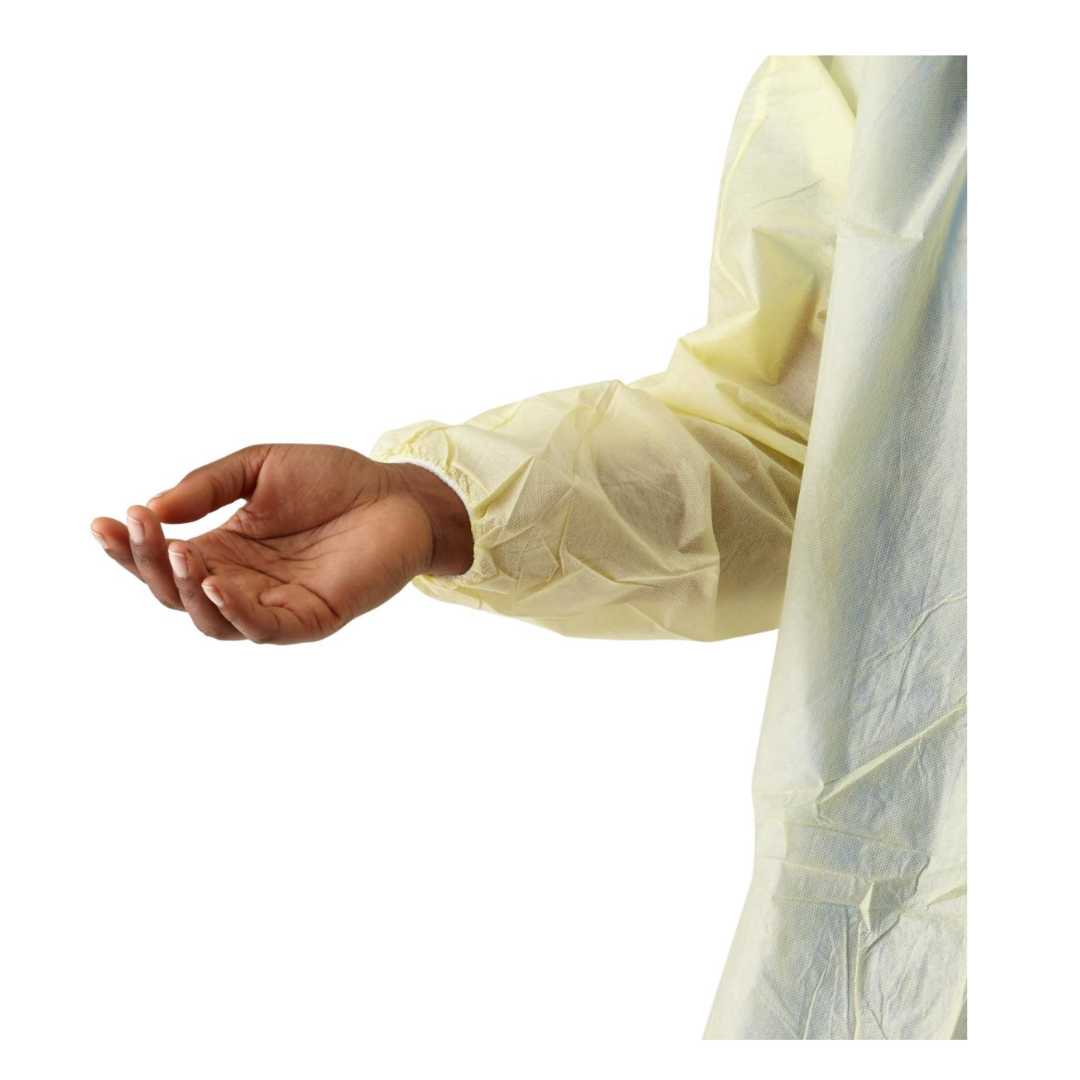 A person wearing a yellow Medline Disposable Full Back Spunbond Cover Gown extends their left arm with a relaxed, palm-up hand against a white background.
